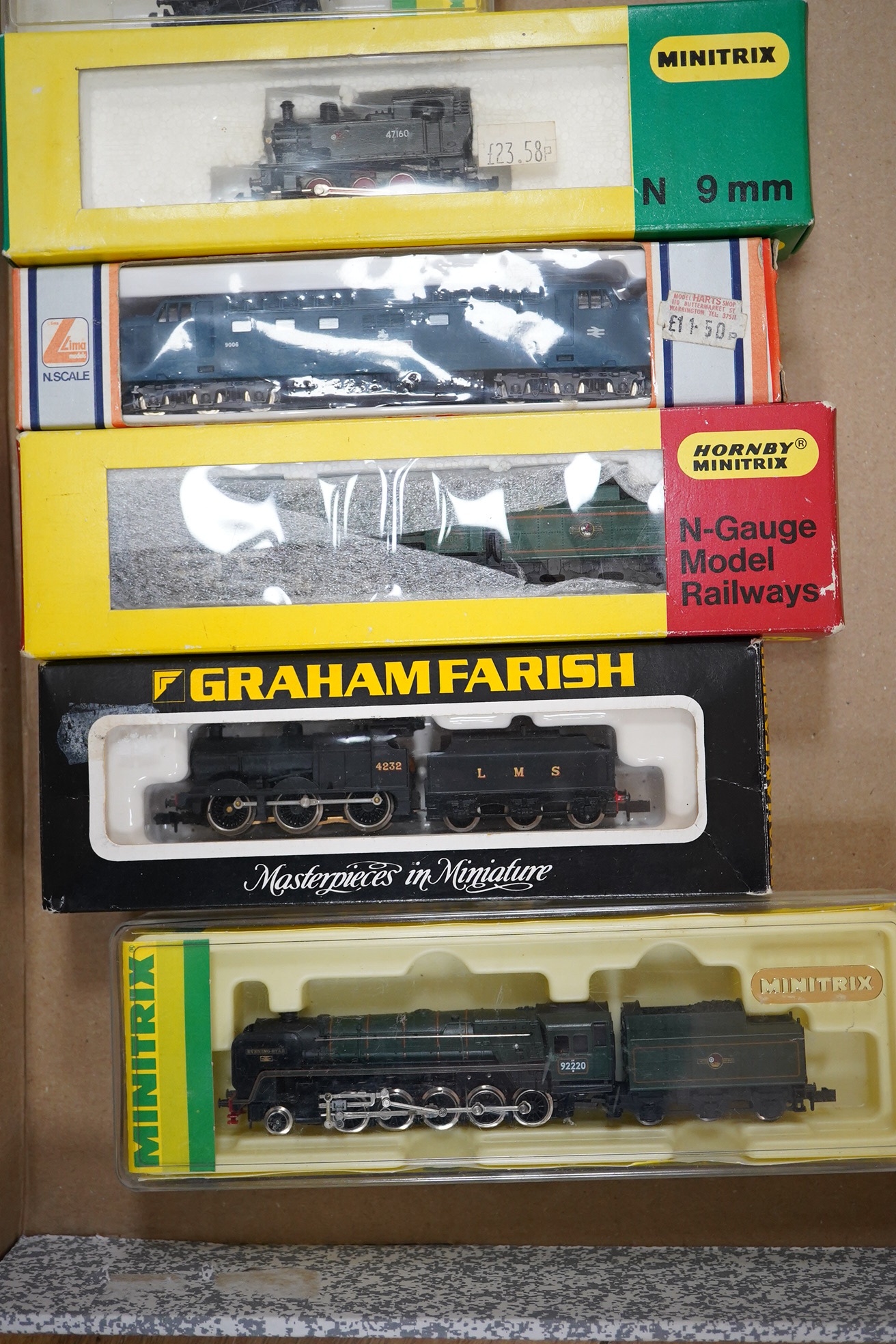 Nineteen boxed N gauge railway items by Graham Farish, Minitrix, etc., including five locomotives; a BR Class 9F, an LMS Class 4F, a BR Britannia Class, a BR Deltic Co-Co diesel, and a BR 0-6-0T, together with seventeen